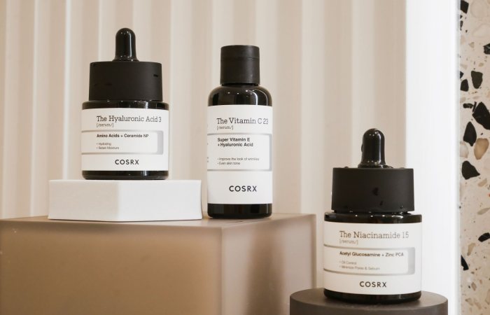 Elegant display of COSRX skincare bottles on a modern backdrop. Perfect for beauty and wellness content.